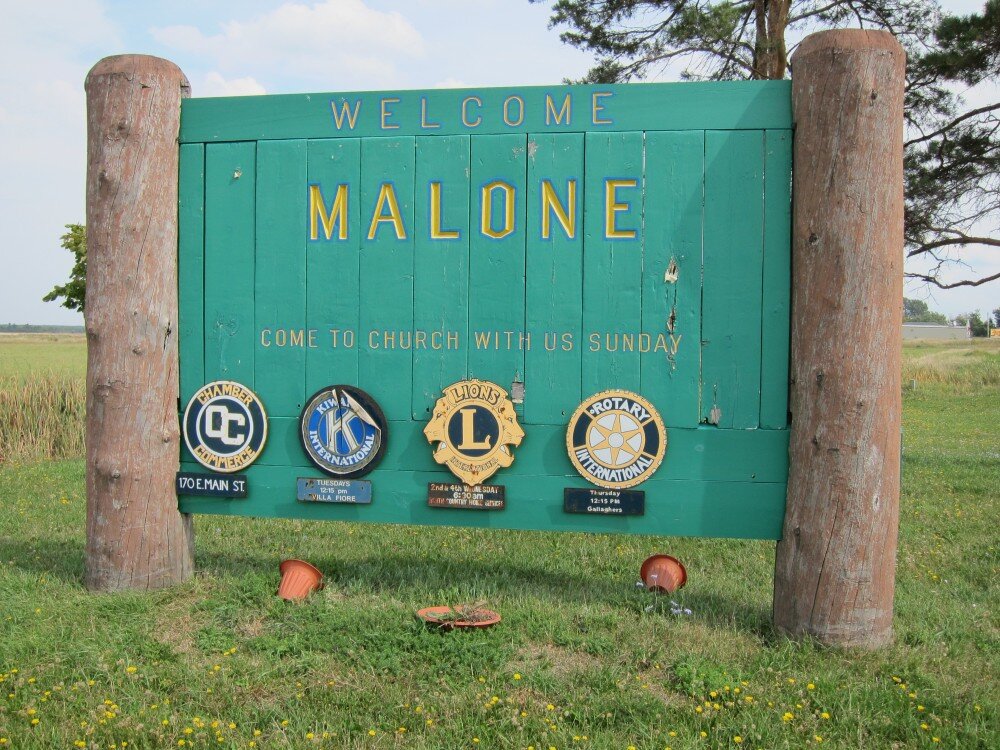 Welcome to Malone, NY roadside sign